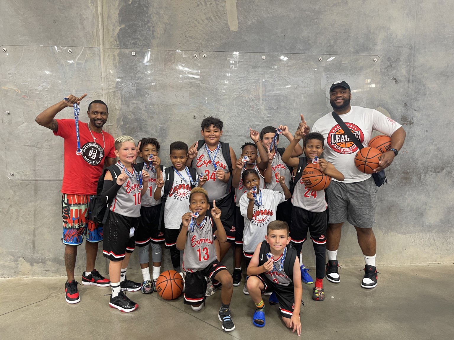Young 287 Express basketball team showing their medals