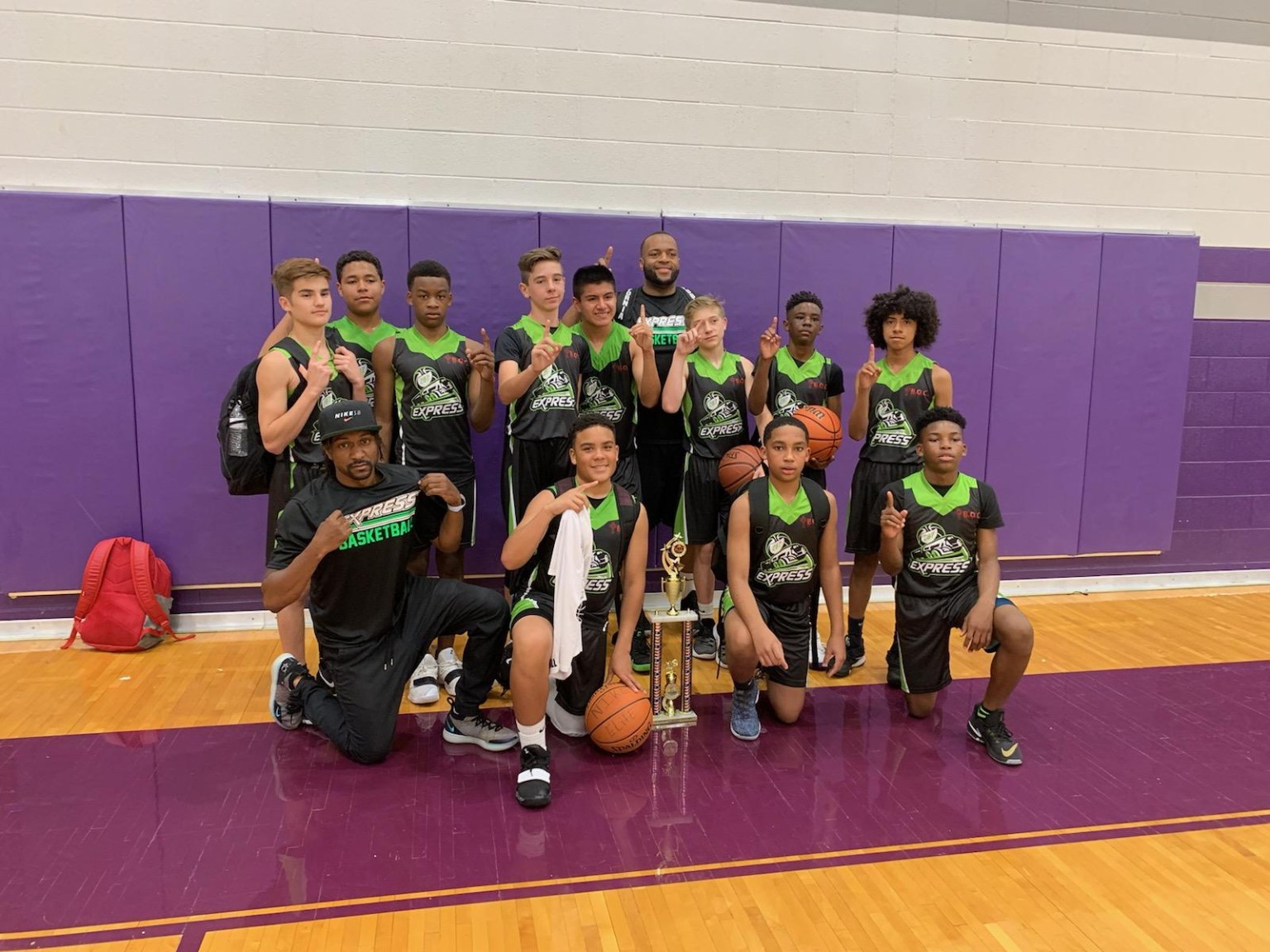 287 Express basketball team with a tournament trophy